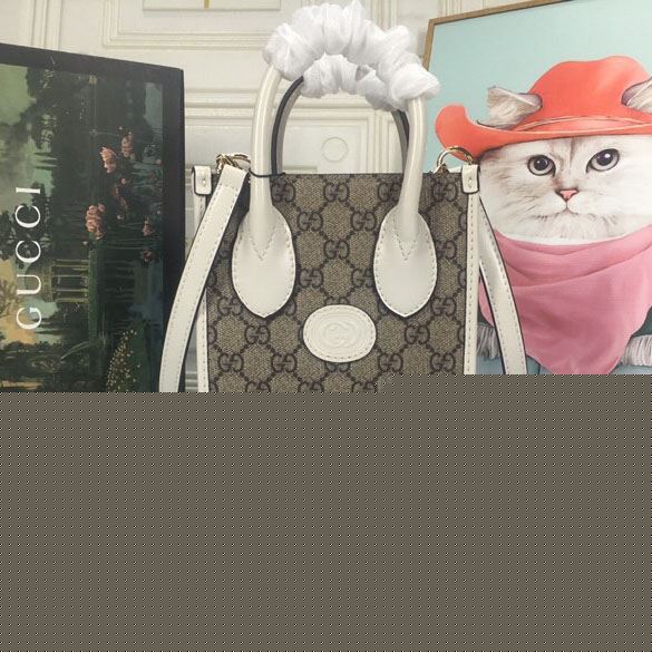 G*u*i top handle bags